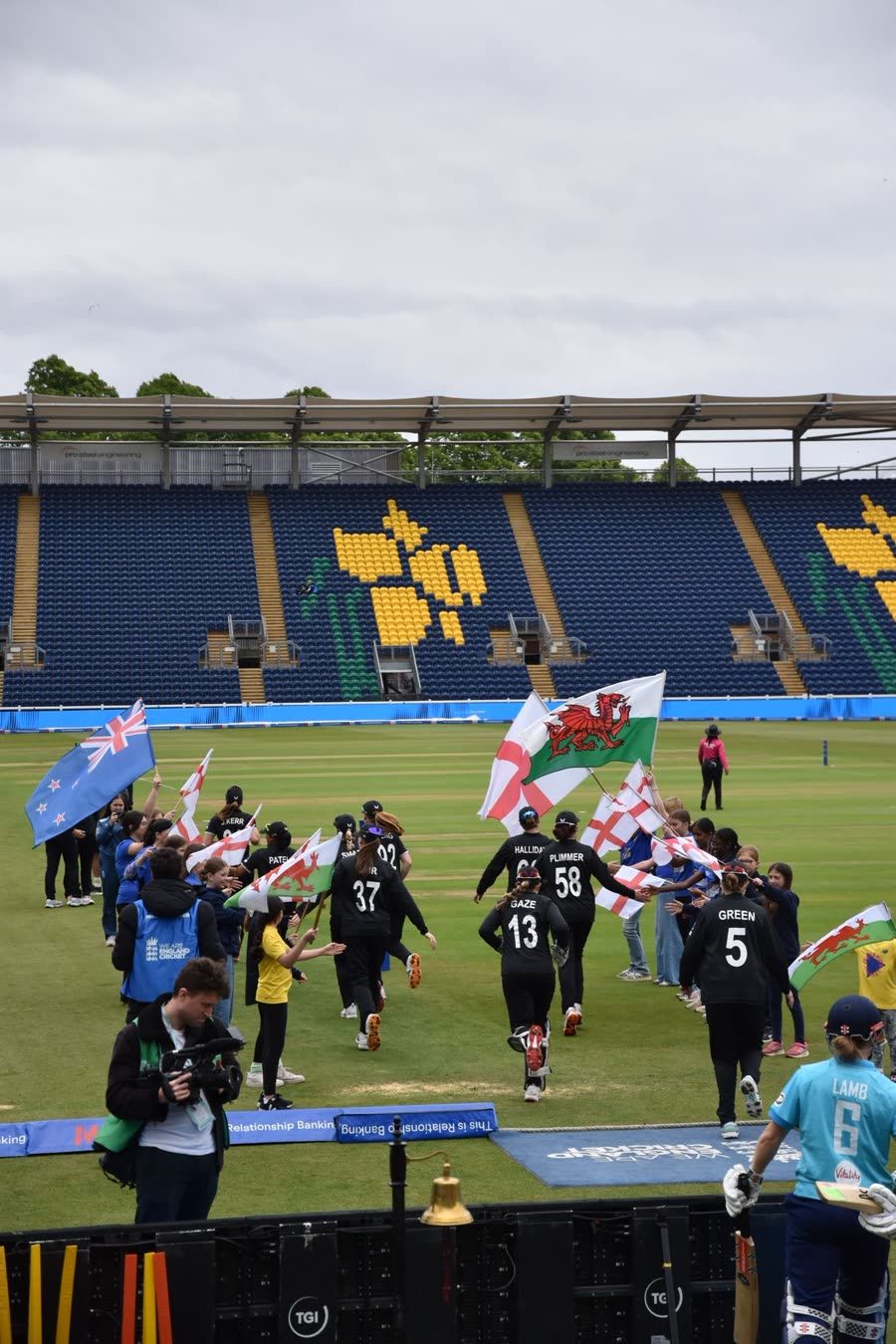 New Zealand players running out through the Sapphires guard of honour