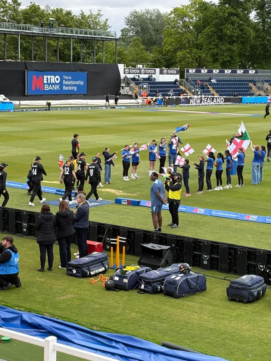 New Zealand players walking past the Sapphires flag line